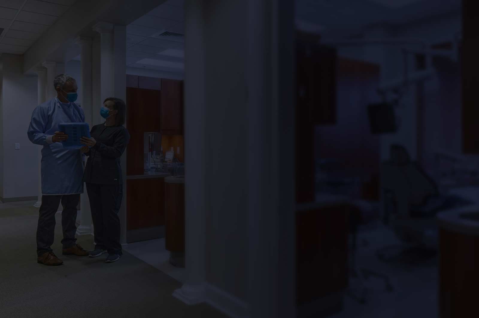 Medical staff talking in a hallway